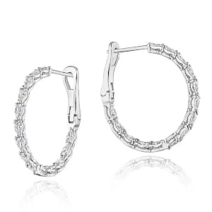 A pair of pear-shaped diamond hoop earrings in 14k white gold.