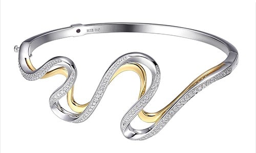 This sterling silver bangle from ELLE uses geometric patterns and diamonds to draw visual interest