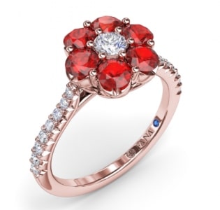 A ruby and diamond side stone fashion ring from Fana features a flower design