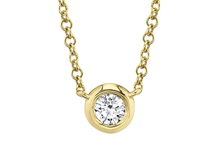 A solitaire diamond necklace from Shy Creation is crafted from yellow gold