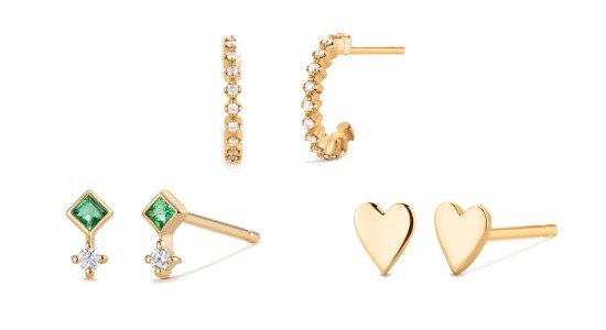 Three pairs of gold earrings, one featuring green gems and diamonds