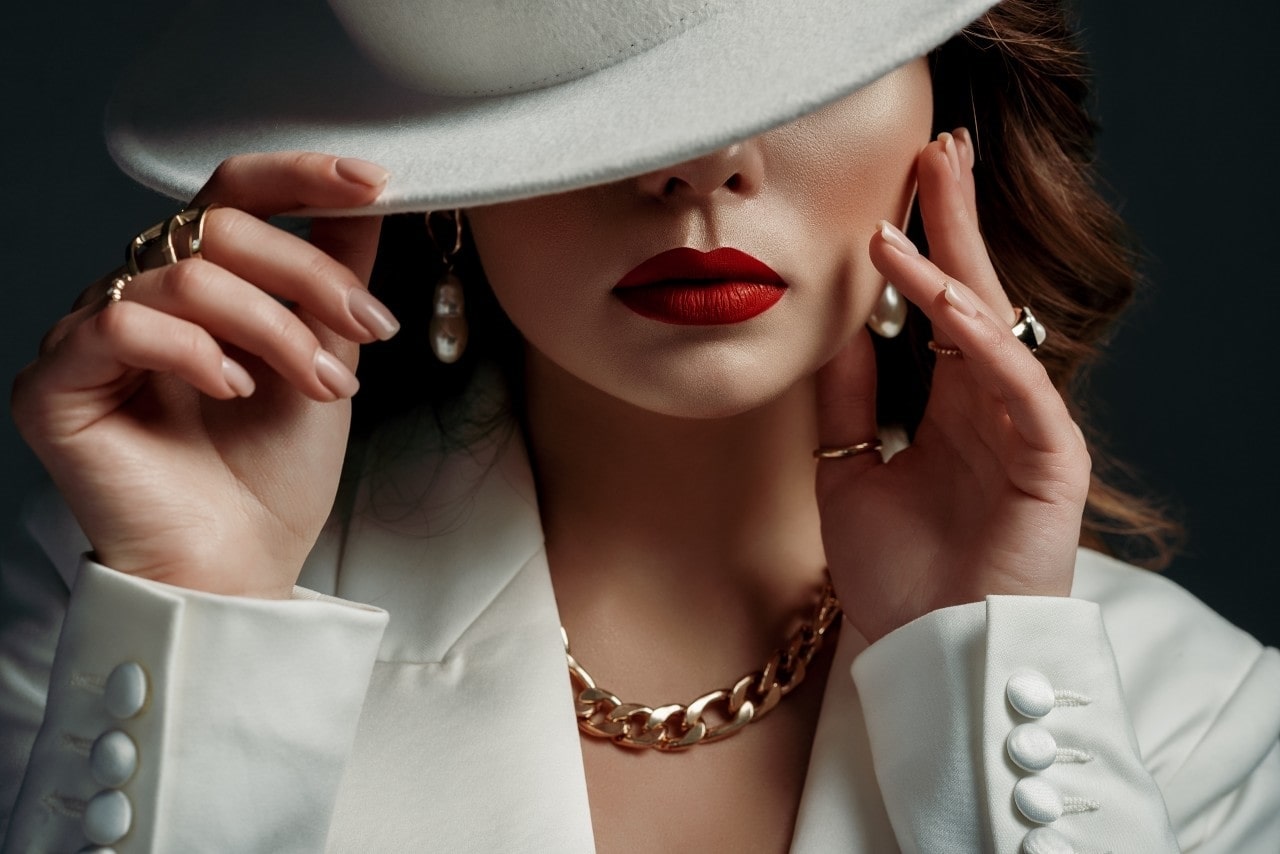 A lady wearing stylish clothes and jewelry by Fana