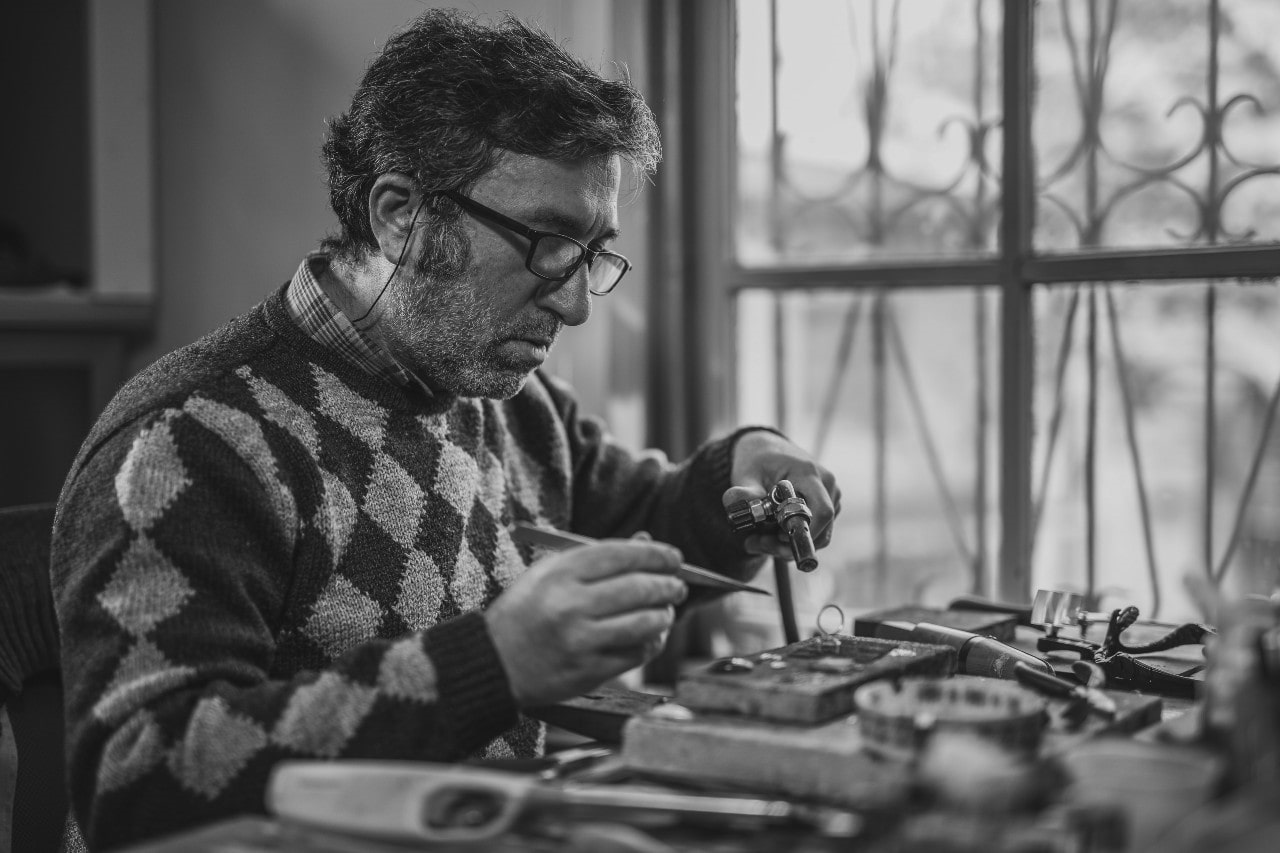 A jewelry artisan handcrafting pieces by Allison-Kaufman