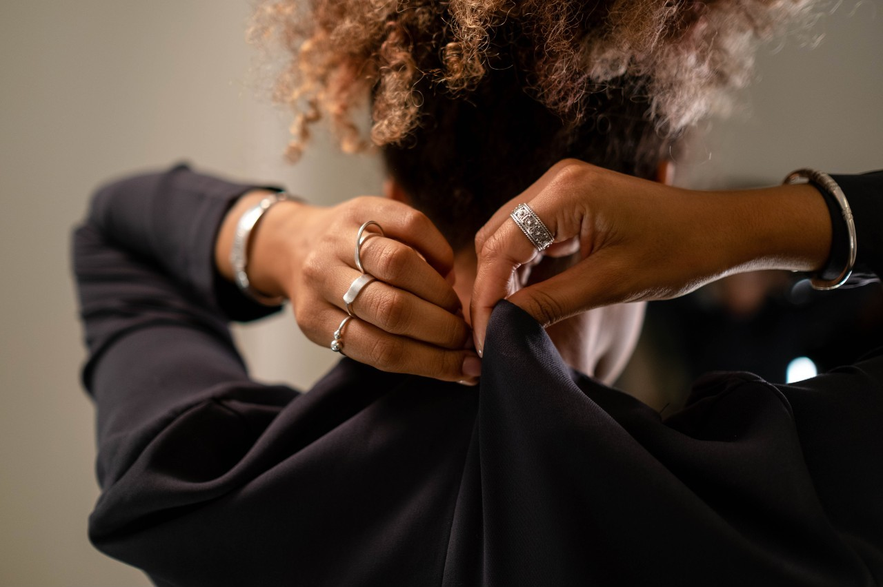 A lady wearing rings and a bracelet by Shy Creation