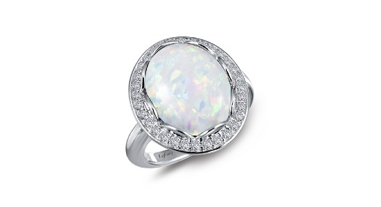 a sterling silver statement ring featuring a large opal and diamond accents